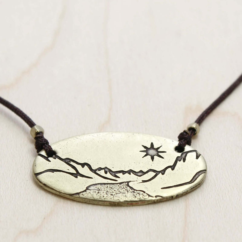 St. Mary Lake in Glacier Necklace featuring intricate acid-free etching design in Antique Brass finish.