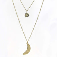 Sun and Moon Long Layered Necklace featuring a hammered crescent moon and sun pendant in antique brass.