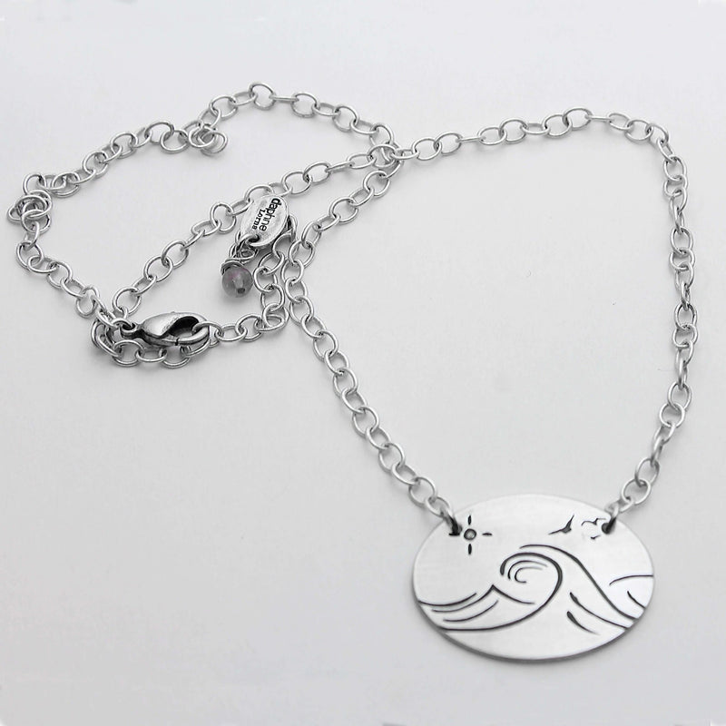 Swell Necklace featuring wave etched design in matte silver, adjustable 18" cable chain, handmade in Montana.