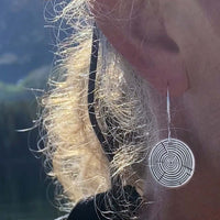 Timber Earrings- Tree Rings featured in a close-up, showing a design resembling tree rings with silver earwires.
