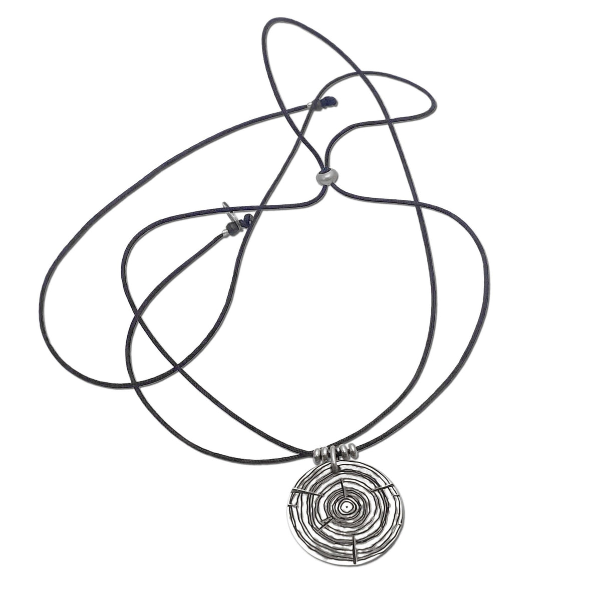 Stylish Timber Necklace featuring concentric circles and adjustable black cord, perfect for nature lovers.