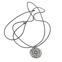 Stylish Timber Necklace featuring concentric circles and adjustable black cord, perfect for nature lovers.