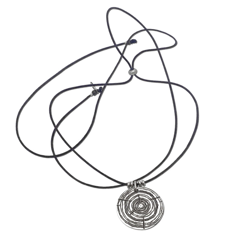 Stylish Timber Necklace featuring concentric circles and adjustable black cord, perfect for nature lovers.