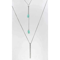 Twig Long Layered Necklace featuring a silver chain with turquoise accents and a sleek bar pendant.