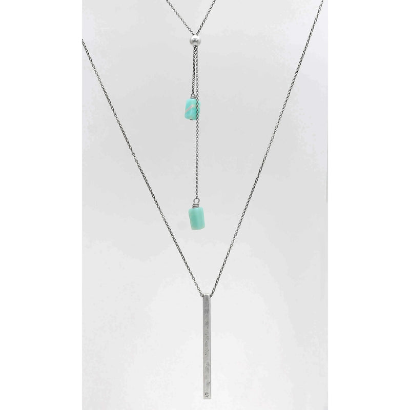 Twig Long Layered Necklace featuring a silver chain with turquoise accents and a sleek bar pendant.