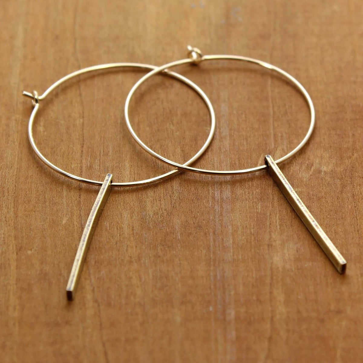 Twigs Hoop Earrings in Antique Brass with twig design, stylish and simple for any outfit, 1" twig length, 2" overall drop.