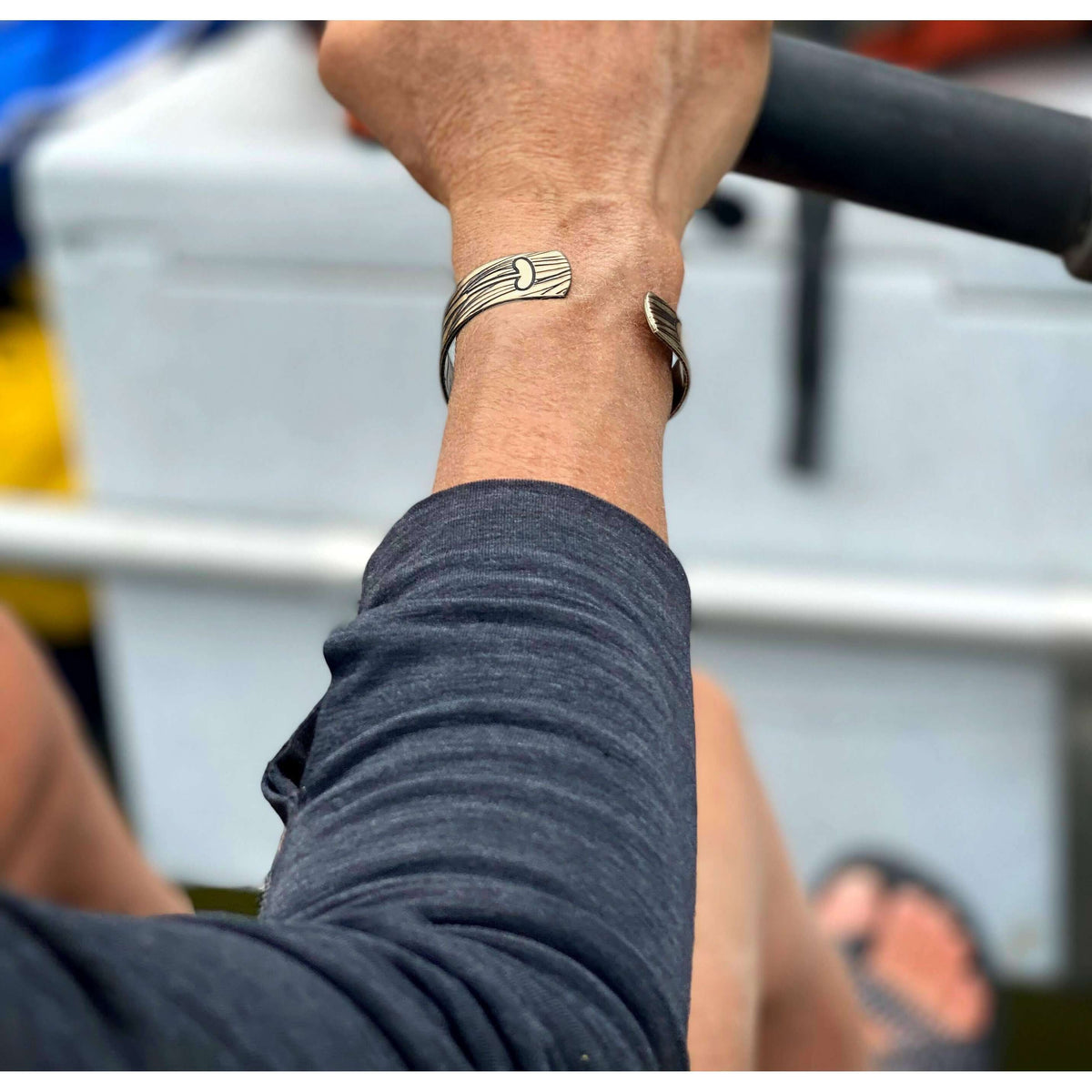 Upstream Cuff Bracelet - Paddle River Rafting Adventure worn on a wrist while rowing.