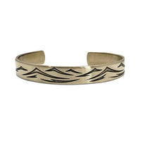 Waves Cuff Bracelet featuring intricate wave pattern in Matte Silver finish, showcasing adjustable design for any wrist size.