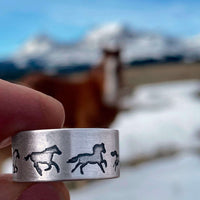Wild Horses Adjustable Ring featuring galloping horses, set against a serene mountain backdrop.