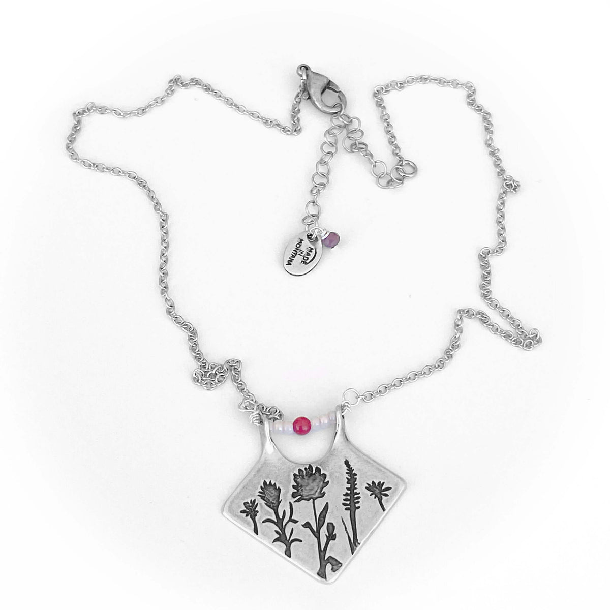 Wildflower Box Necklace featuring Indian Paintbrush and Wild Lupine on a matte silver finish with pink stones.