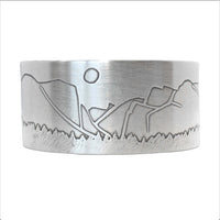 Yosemite Wide Cuff Bracelet- featuring an iconic mountain and sun design in matte silver finish.