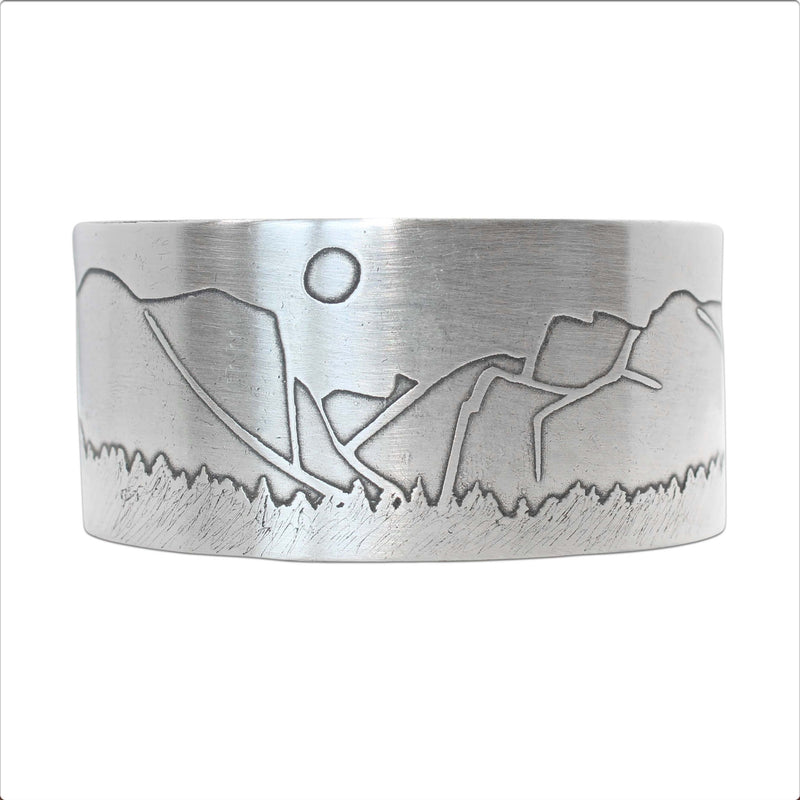 Yosemite Wide Cuff Bracelet- featuring an iconic mountain and sun design in matte silver finish.